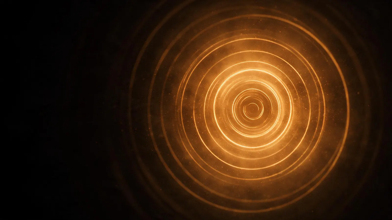 Concentric rings of amber light expanding outward across black, like a sound propagating.